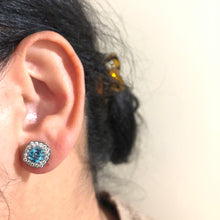 Load image into Gallery viewer, Individually Hand-crafted Pair of Silver Swiss Blue Topaz Gemstone Studs surrounded by Cubic Zirconia & Rhodium.